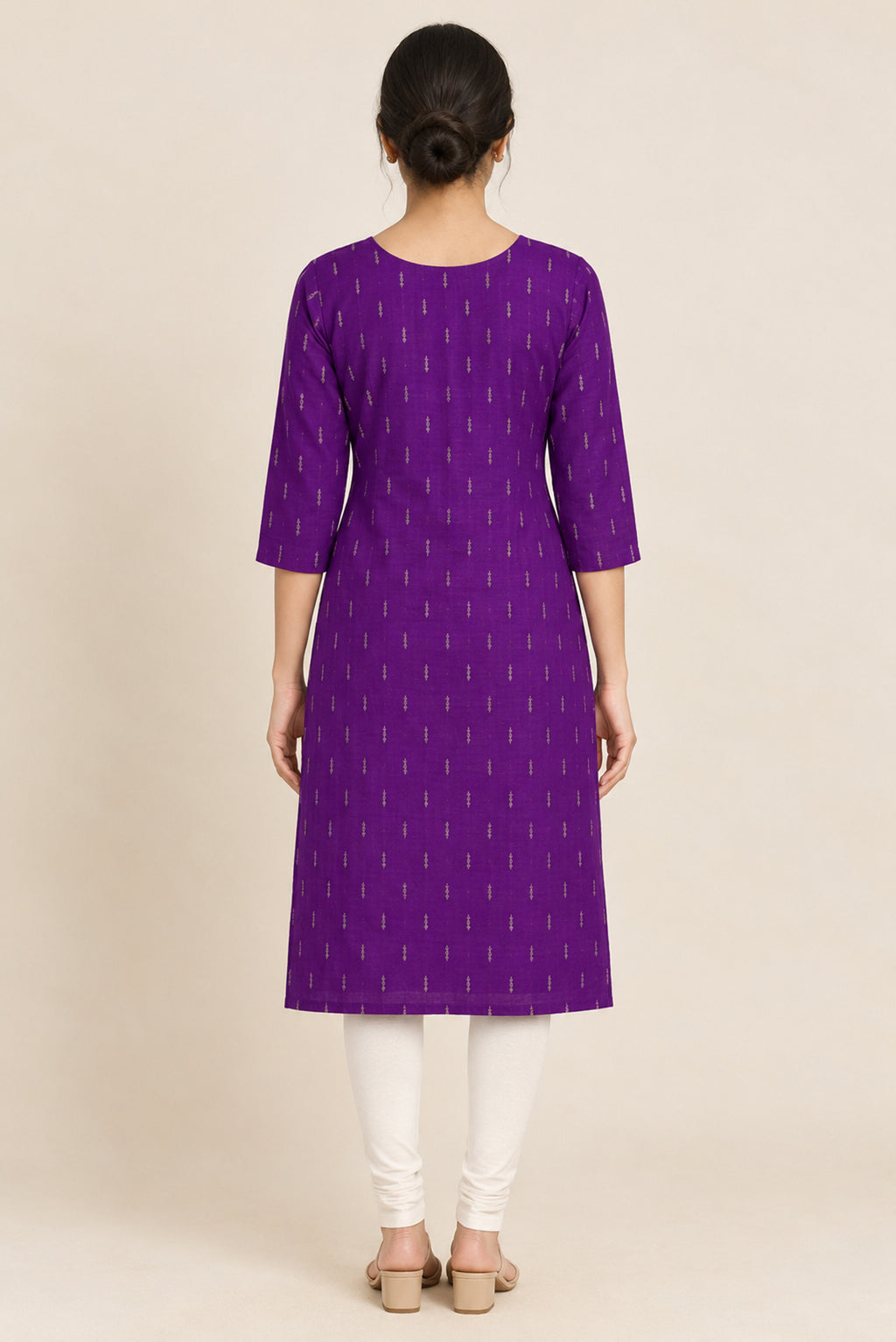 This Purple Cotton Kurta is crafted using Woven Design detailing, featuring Thread Butta design across the silhouette with Round neck back image displayed on an AI model