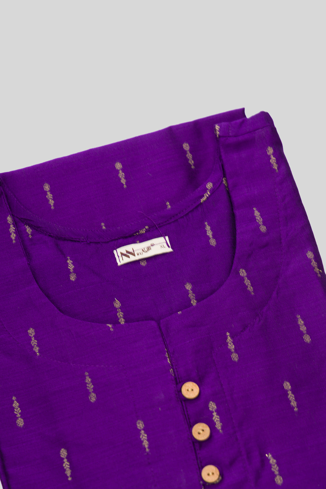 Detailed shot of This Purple Cotton Kurta is crafted using Woven Design detailing, featuring Thread Butta design across the silhouette with Round neck