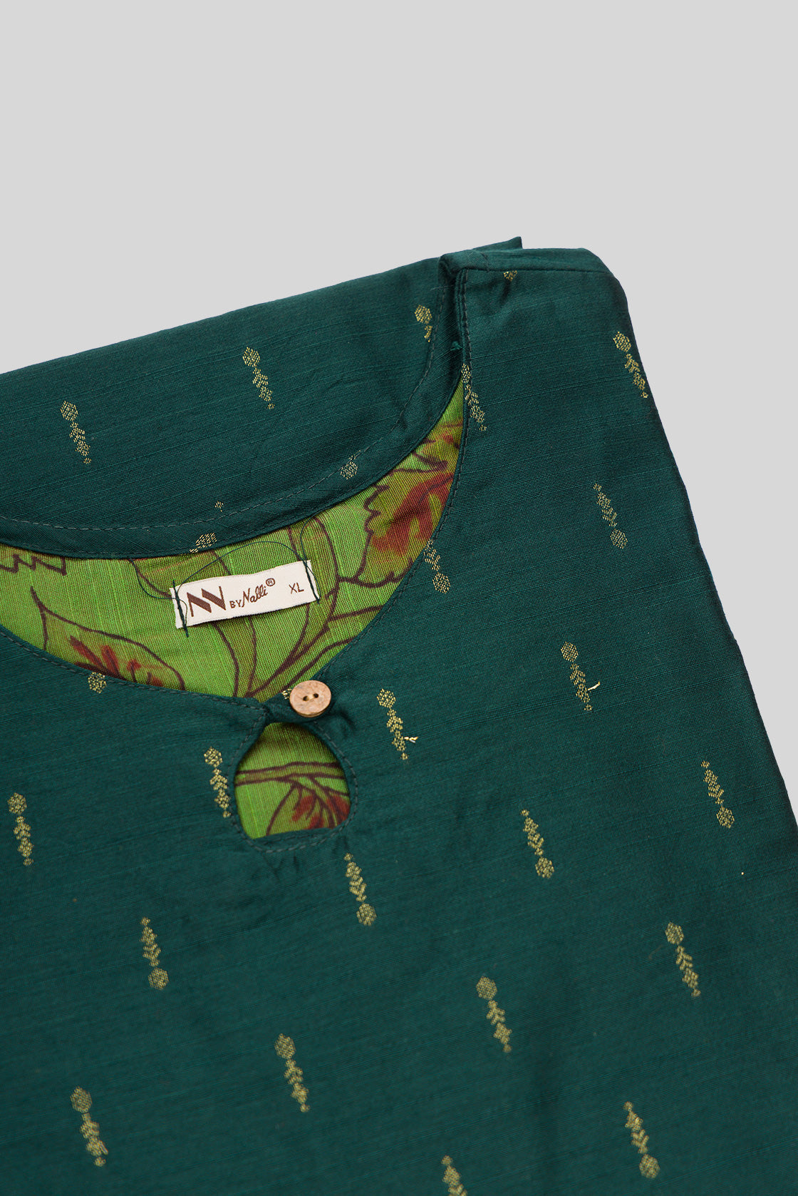 Detailed shot of This Bottle Green Cotton Kurta is crafted using Woven Design detailing, featuring Thread Butta design across the silhouette with Keyhole neck