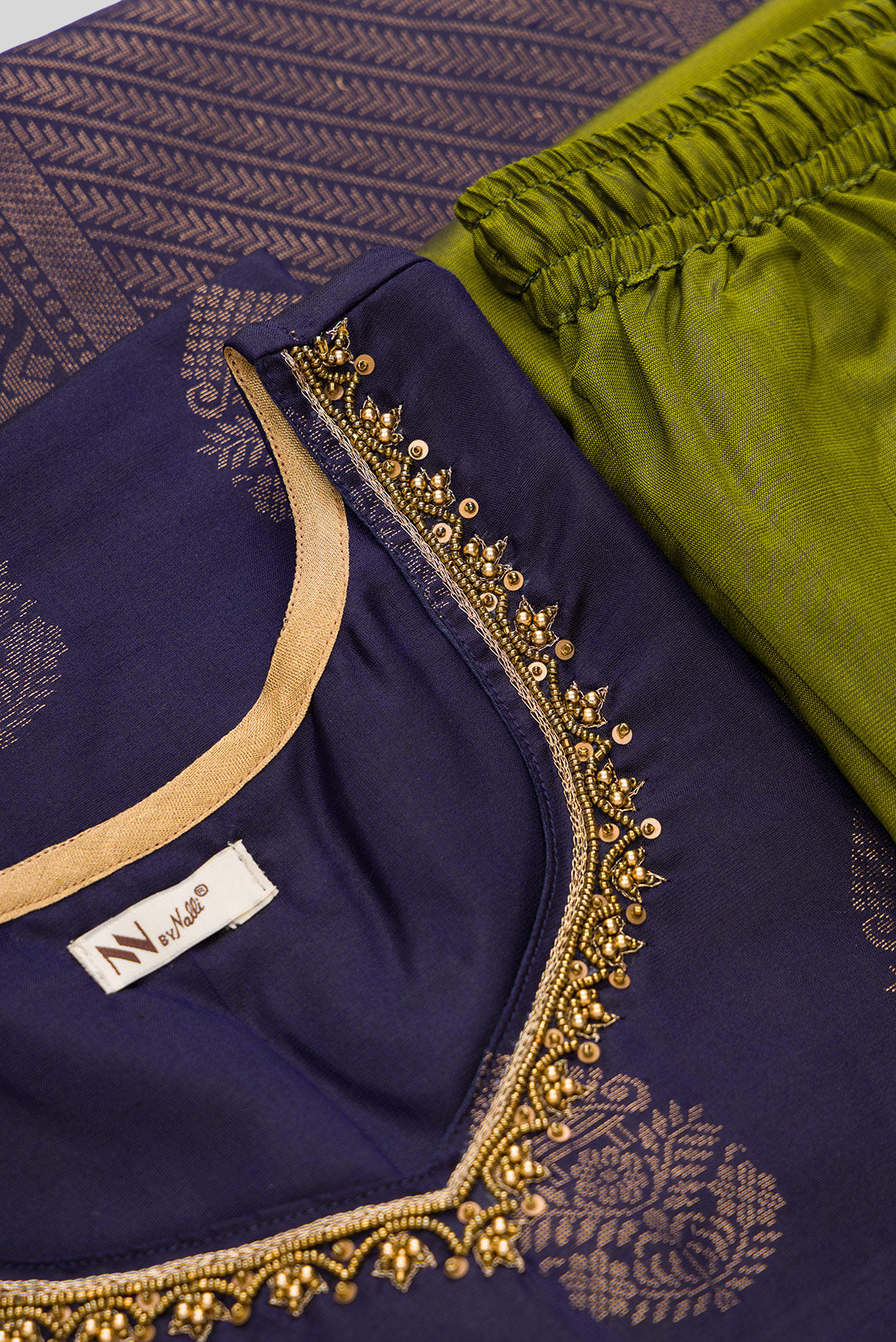 Detailed shot of Navy Blue Pure Silk Womens Kurta set featuring Zari Butta Kurta paired with Mehandi Green Plain Body bottom and a Zari Butta dupatta in Mehandi Green