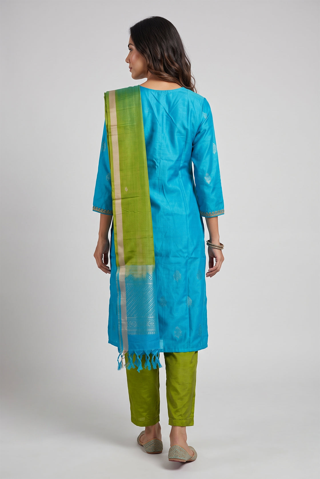 Sky Blue Pure Silk Womens Kurta set featuring Zari Butta Kurta paired with Mehandi Green Plain Body bottom and a Zari Butta dupatta in Mehandi Green back image displayed on an AI model