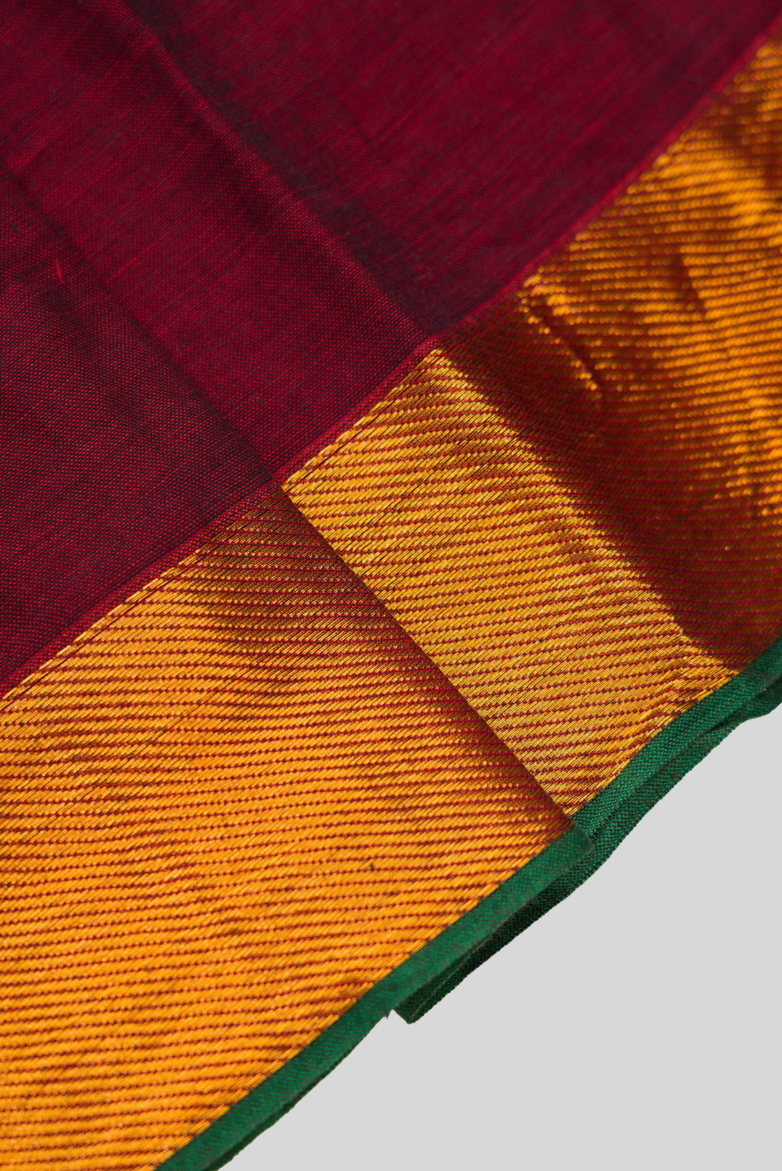 Detailed shot of Maroon  Kids Ethnic Dress featuring a U-neck, Sleeveless Design and Plain Body Pattern with Gold Zari Detailing