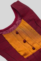 Close up blouse image of Maroon  Kids Ethnic Dress featuring a U-neck, Sleeveless Design and Plain Body Pattern with Gold Zari Detailing