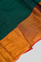 Detailed shot of Green  Kids Ethnic Dress featuring a U-neck, Sleeveless Design and Plain Body Pattern with Gold Zari Detailing