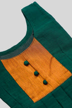 Close up blouse image of Green  Kids Ethnic Dress featuring a U-neck, Sleeveless Design and Plain Body Pattern with Gold Zari Detailing