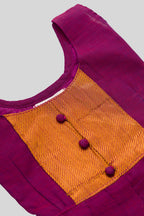 Close up blouse image of Magenta  Kids Ethnic Dress featuring a U-neck, Sleeveless Design and Plain Body Pattern with Gold Zari Detailing