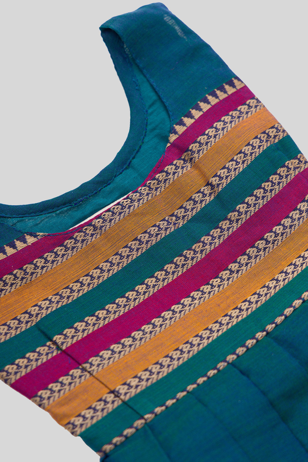 Close up blouse image of Peacock Blue  Kids Ethnic Dress featuring a U-neck, Sleeveless Design and Plain Body Pattern with No Color Zari Detailing