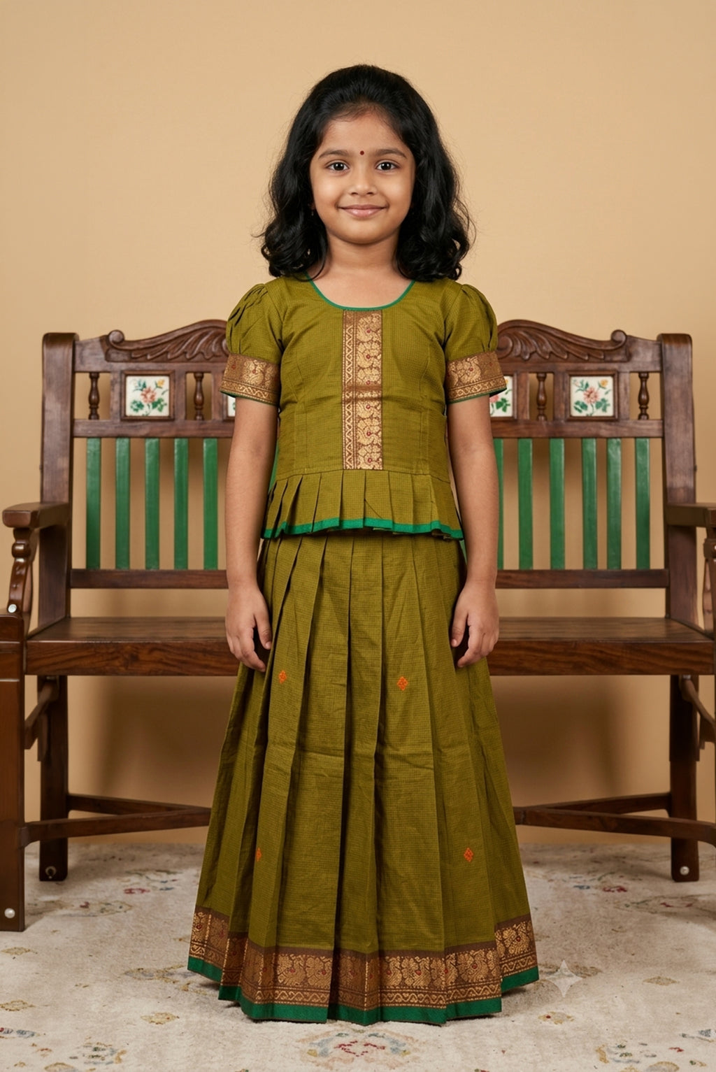 Green Readymade Cotton Pavadai Set with Zari Butta on the body and Thread Border displayed on a mannequin