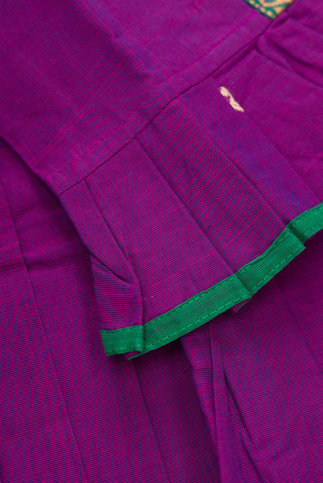 Detailed shot of Green Readymade Cotton Pavadai Set with Zari Butta on the body and Thread Border