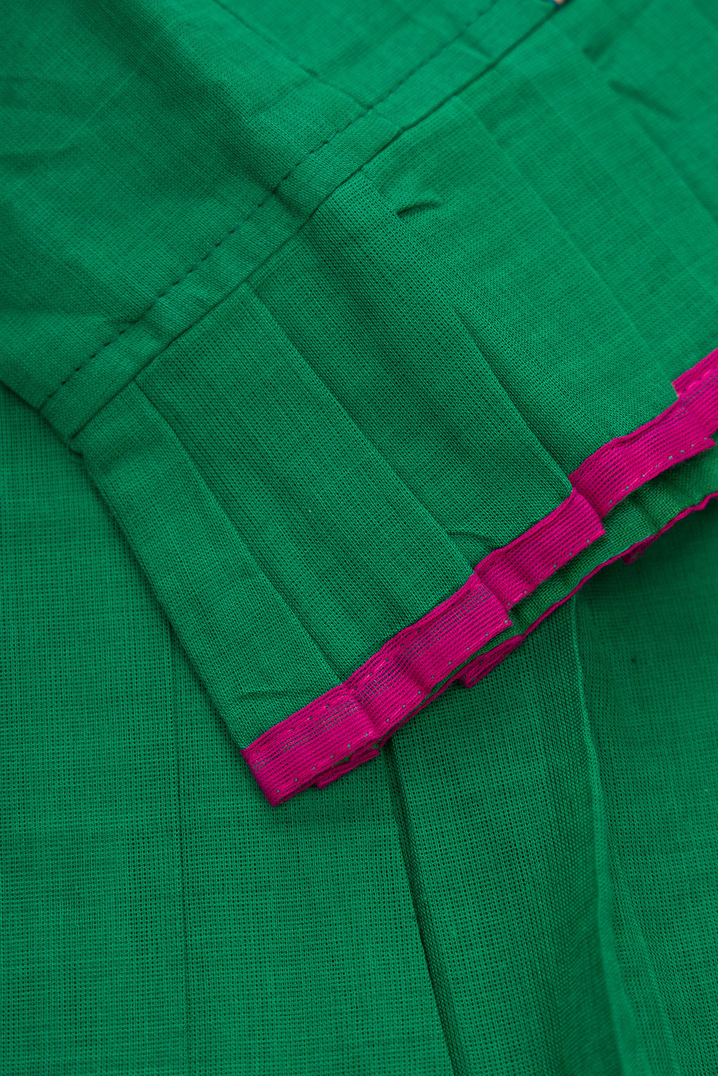 Detailed shot of Green Readymade Cotton Pavadai Set with Zari Butta on the body and Thread Border