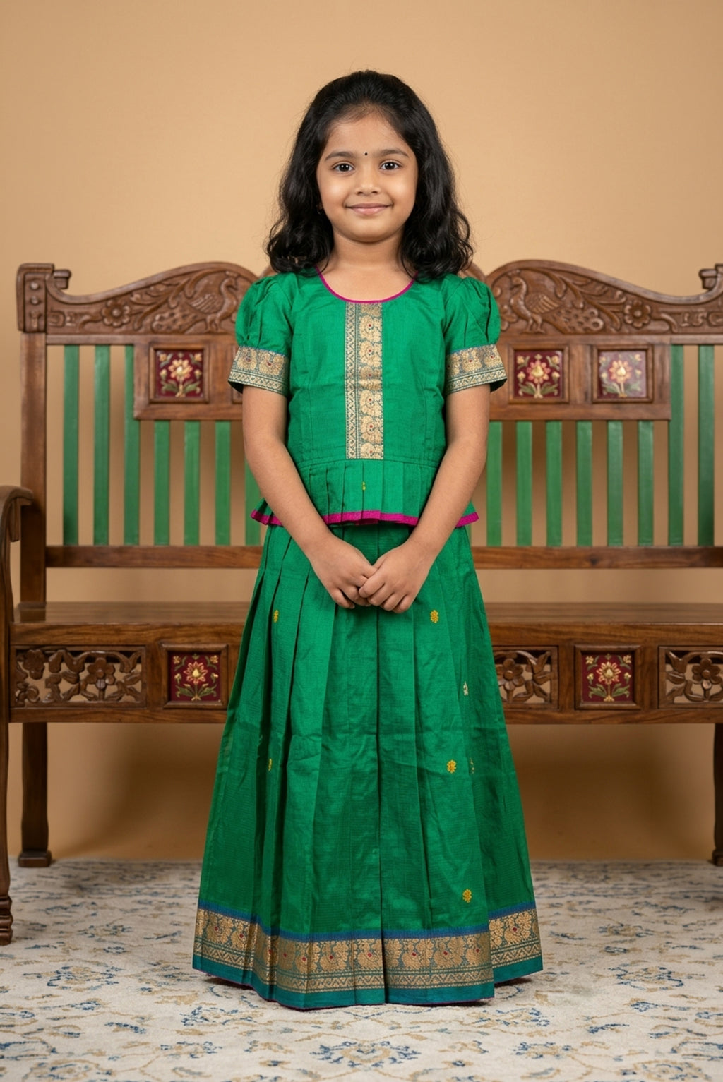 Green Readymade Cotton Pavadai Set with Zari Butta on the body and Thread Border displayed on a mannequin