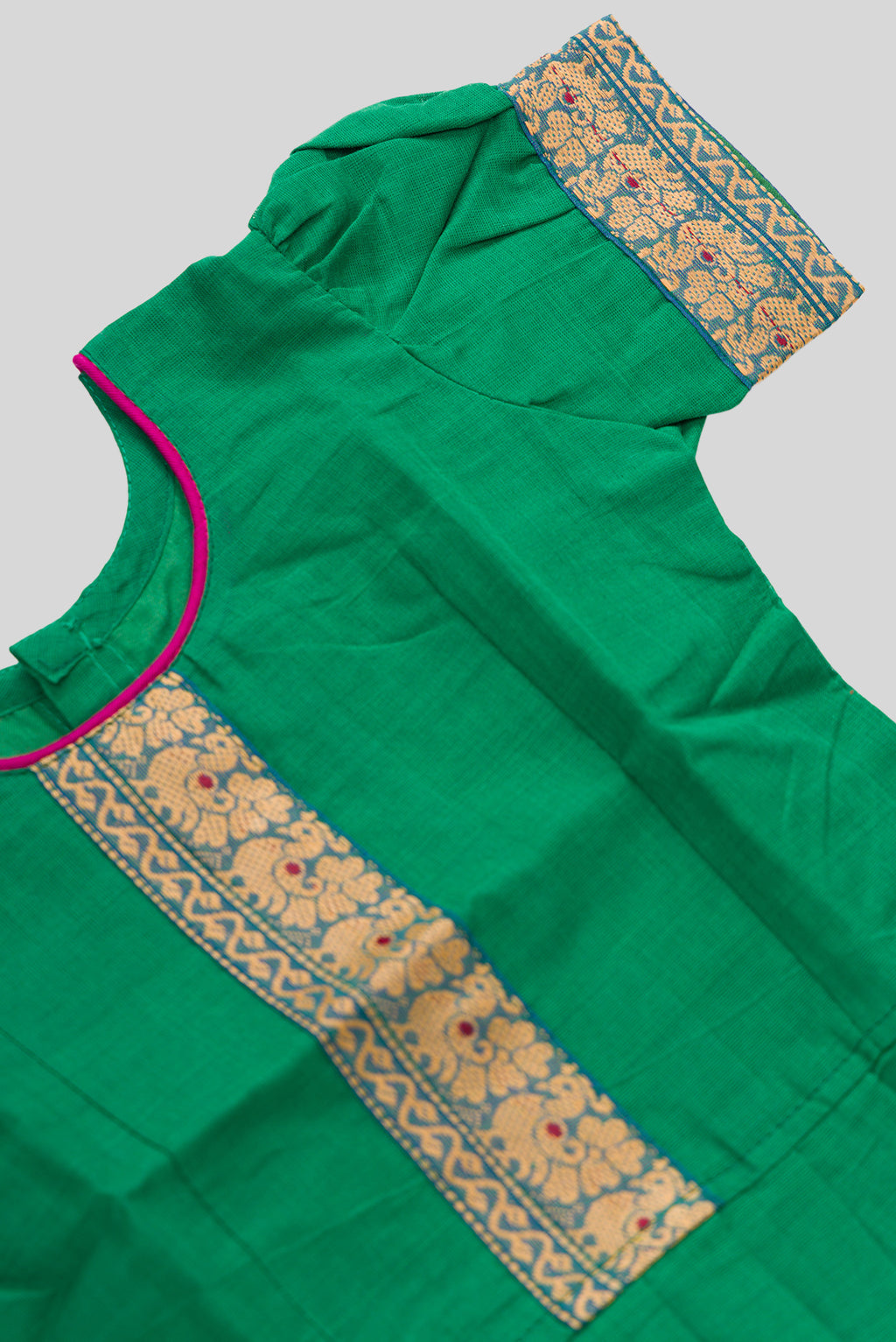 Close up sleeve details of Green Readymade Cotton Pavadai Set with Zari Butta on the body and Thread Border