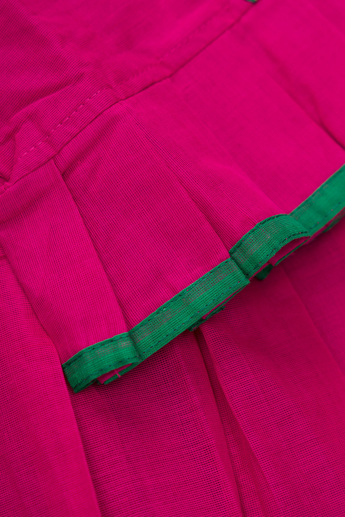 Detailed shot of Green Readymade Cotton Pavadai Set with Zari Butta on the body and Thread Border