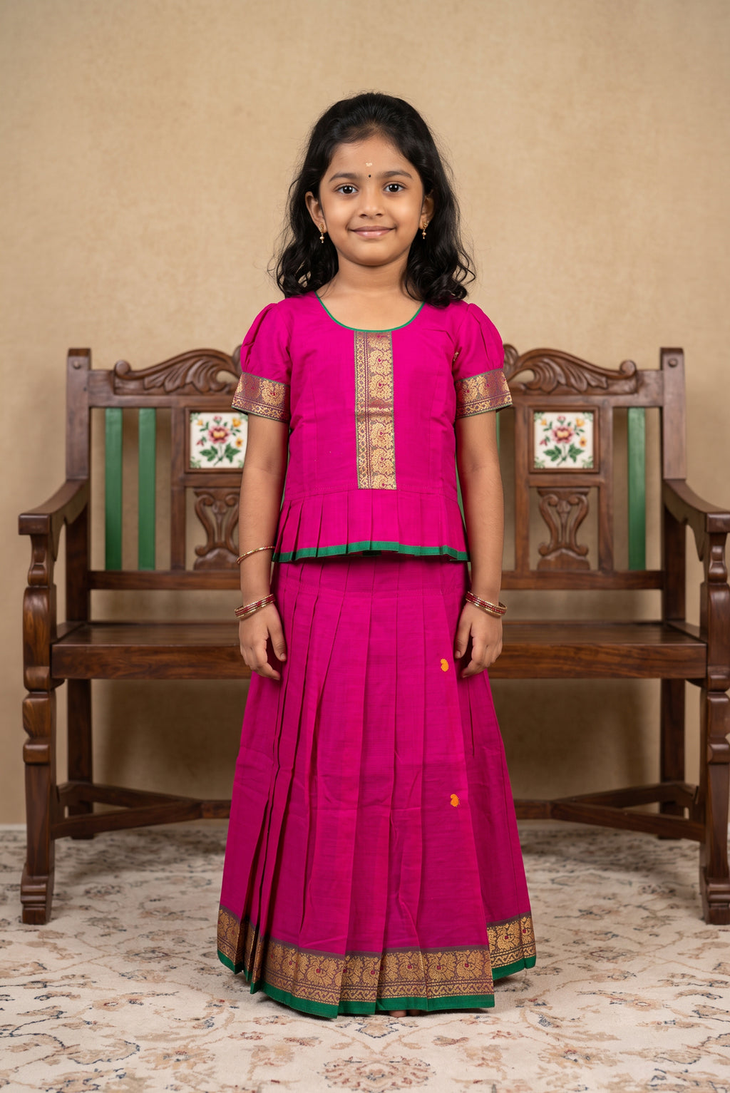 Green Readymade Cotton Pavadai Set with Zari Butta on the body and Thread Border displayed on a mannequin