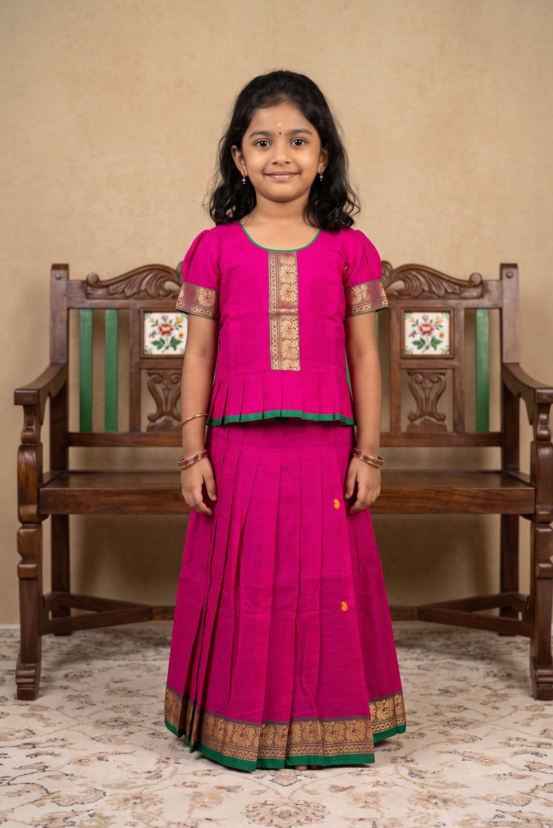 Green Readymade Cotton Pavadai Set with Zari Butta on the body and Thread Border displayed on a mannequin