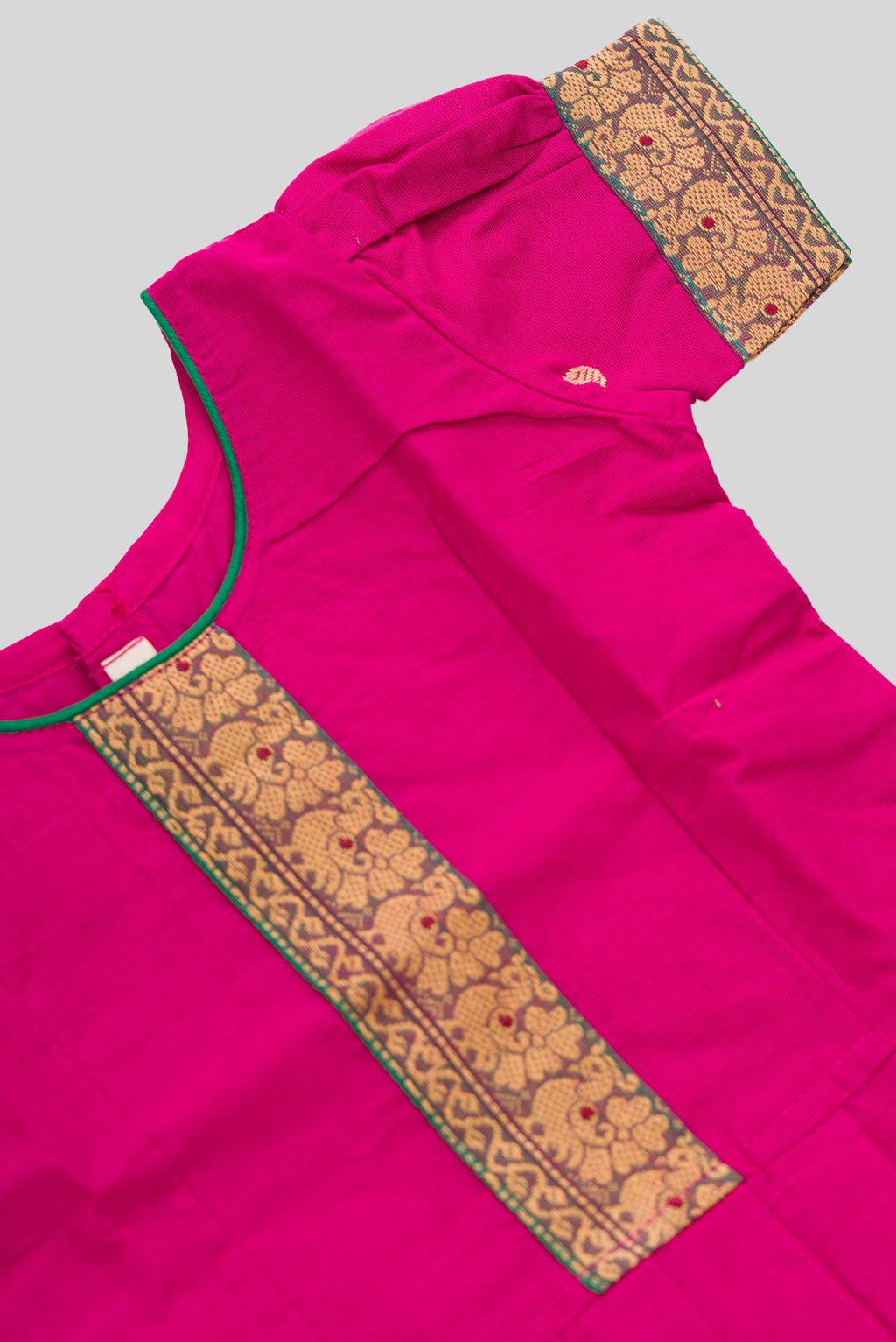 Close up sleeve details of Green Readymade Cotton Pavadai Set with Zari Butta on the body and Thread Border