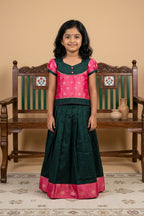 Green Readymade Cotton Pavadai Set with Zari Butta on the body and Fancy Border displayed on a mannequin