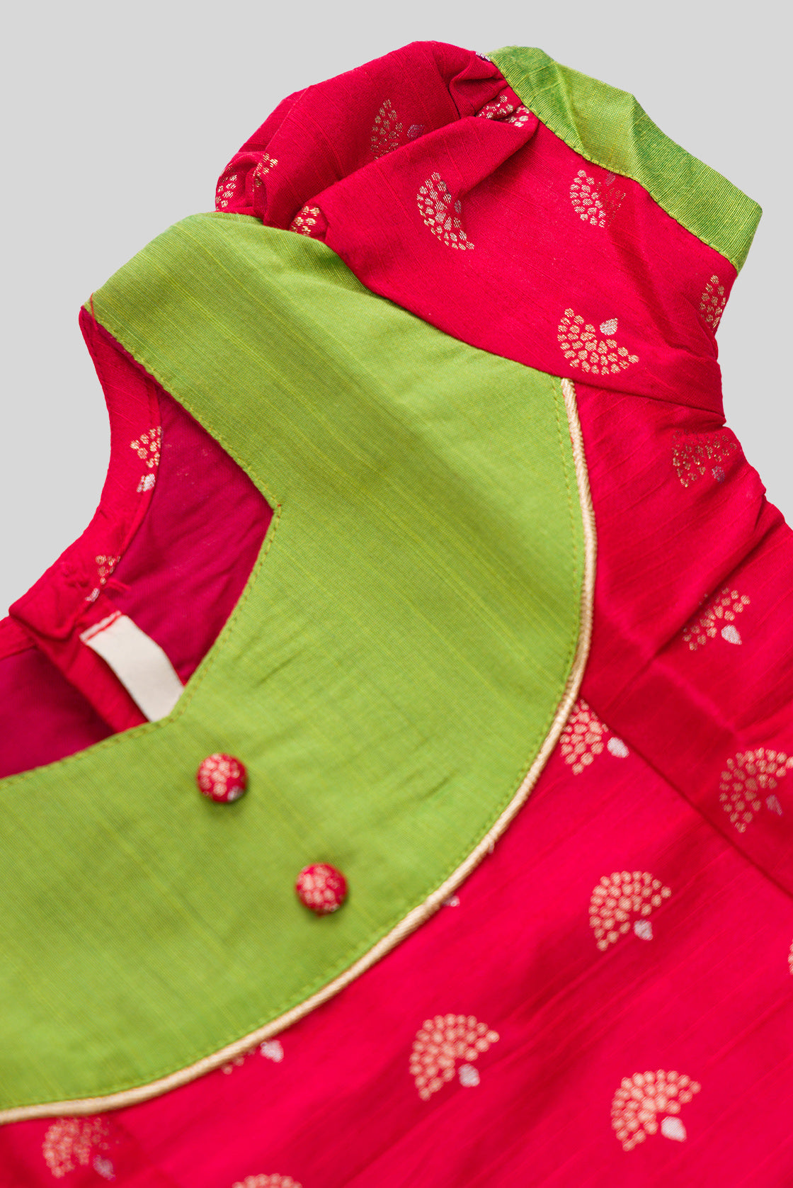 Close up sleeve details of Green Readymade Cotton Pavadai Set with Zari Butta on the body and Fancy Border