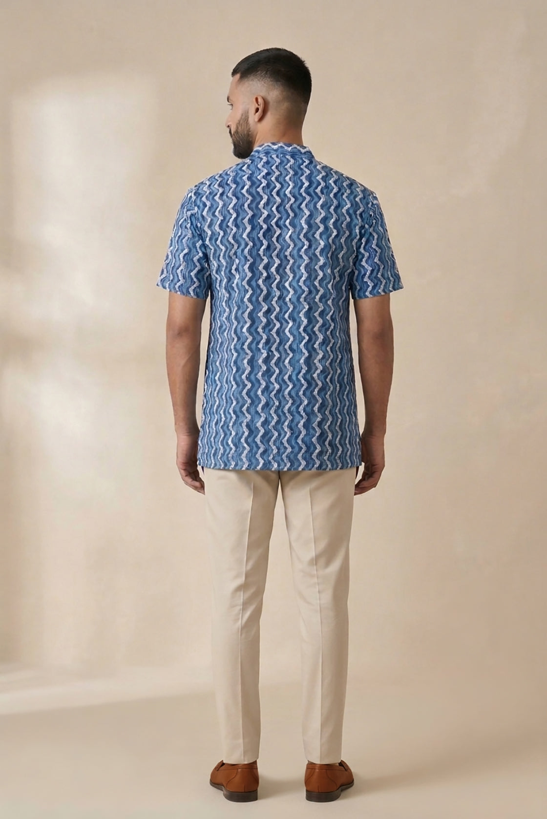 Blue Pure Cotton Printed Mens Kurta back image displayed on an AI model