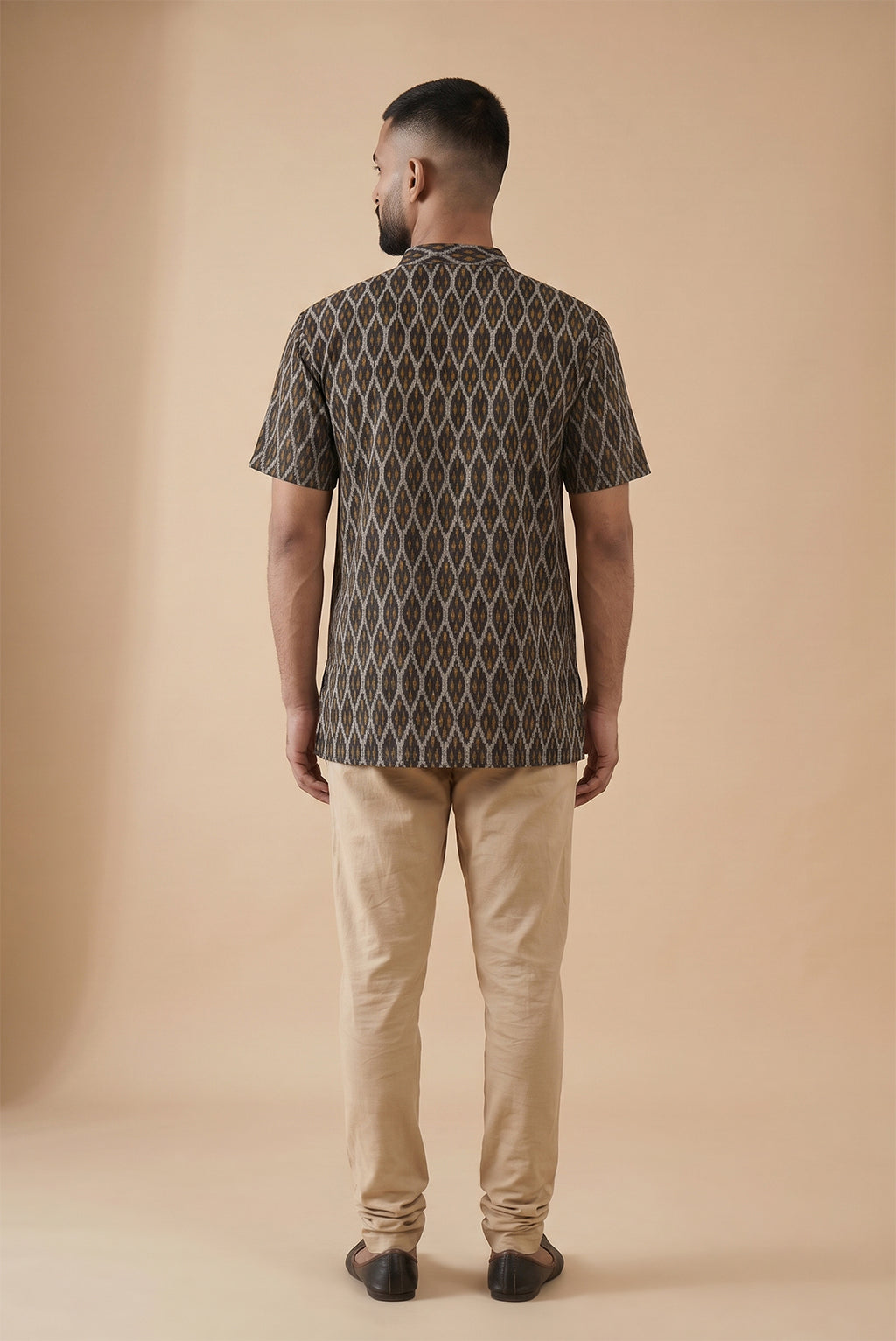 Black Pure Cotton Ikat Print Mens Kurta back image displayed on an AI model