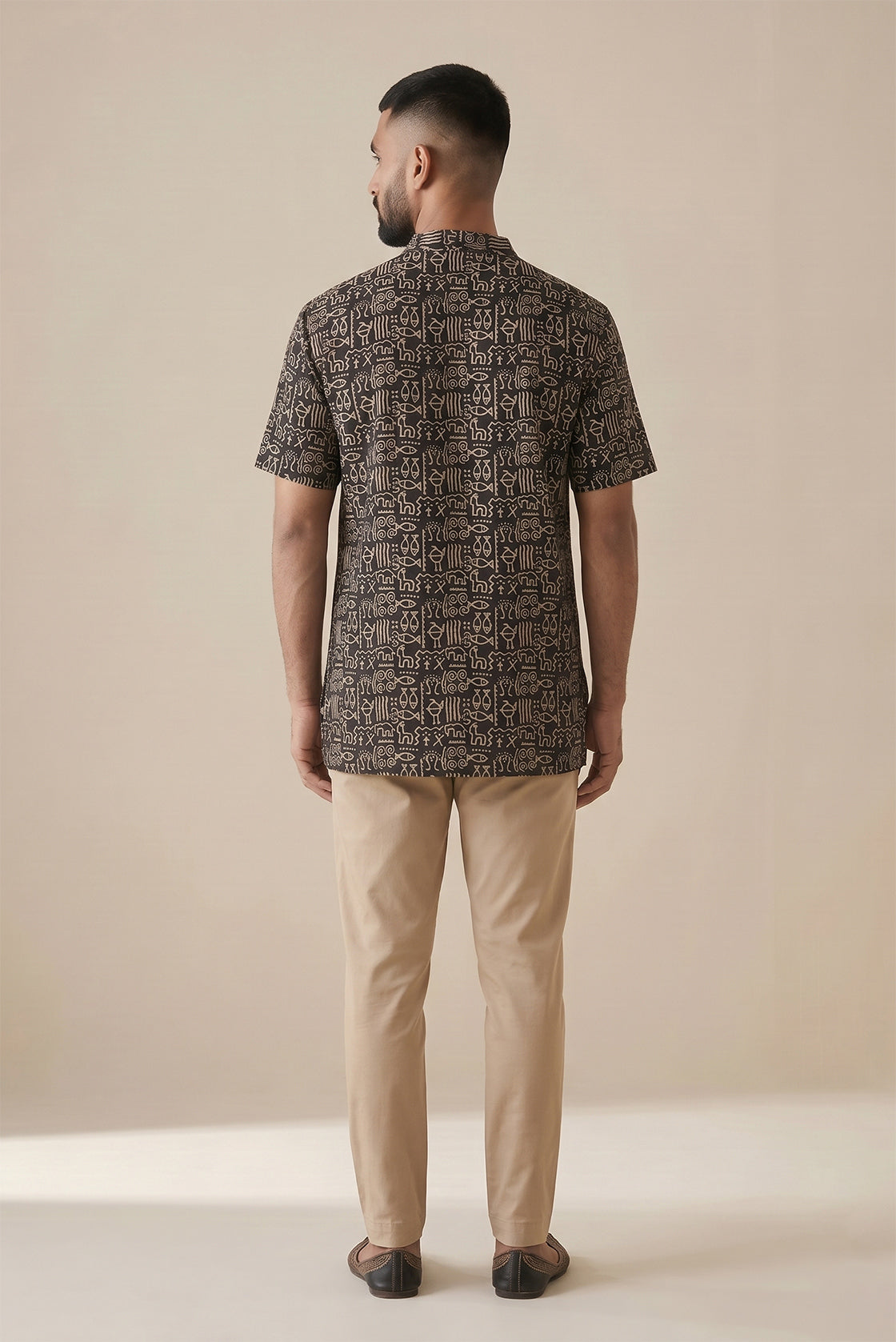 Black Pure Cotton Printed Mens Kurta back image displayed on an AI model