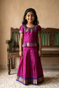 Mehandi Green Readymade Cotton Pavadai Set with Zari Butta on the body and Zari Border displayed on a mannequin
