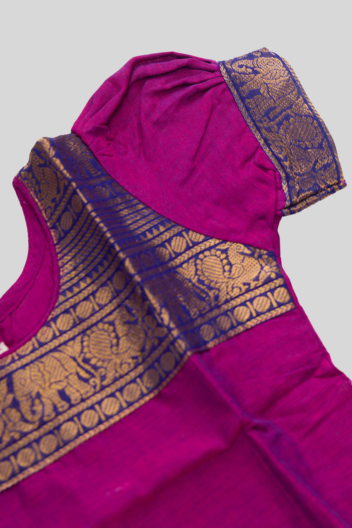 Close up sleeve details of Mehandi Green Readymade Cotton Pavadai Set with Zari Butta on the body and Zari Border