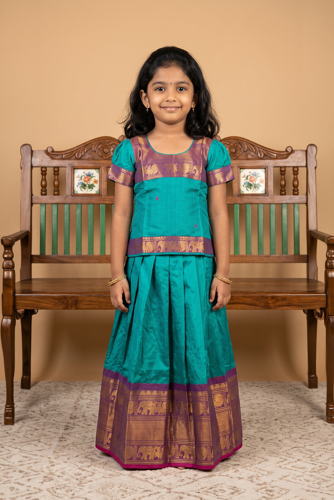 Mehandi Green Readymade Cotton Pavadai Set with Zari Butta on the body and Zari Border displayed on a mannequin