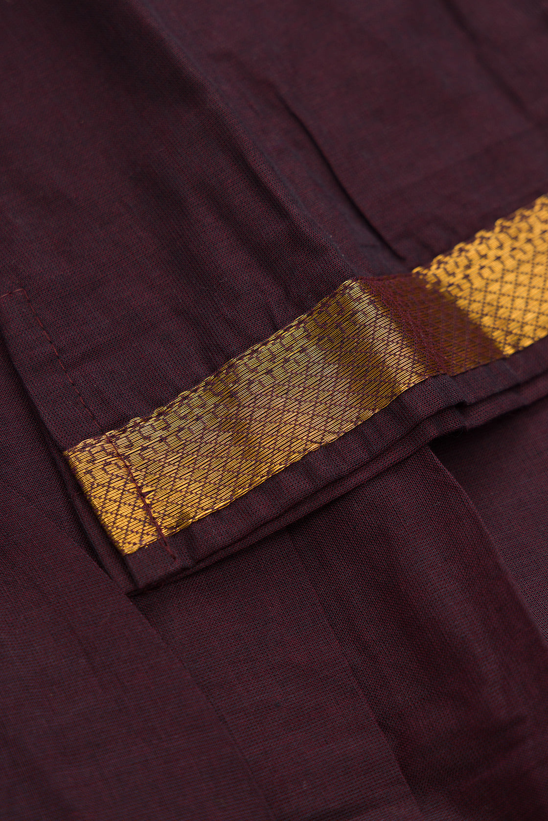 Detailed shot of Mehandi Green Readymade Cotton Pavadai Set with Zari Butta on the body and Zari And Thread Border