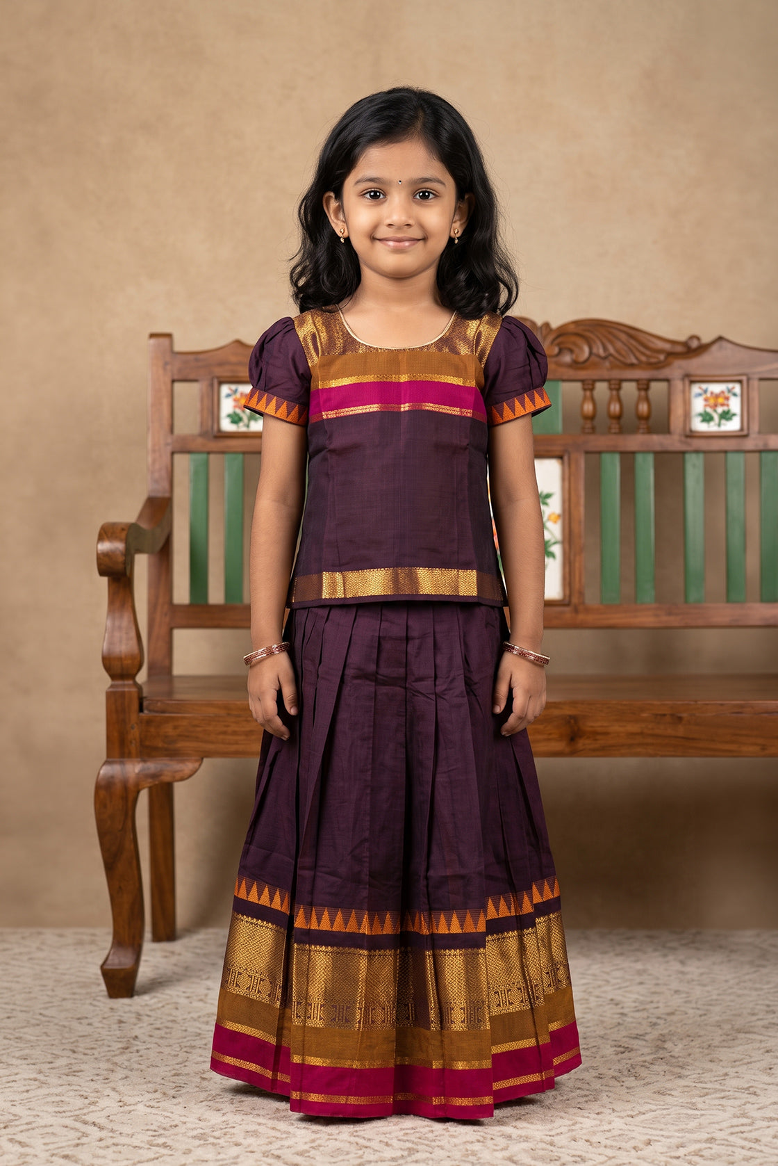 Mehandi Green Readymade Cotton Pavadai Set with Zari Butta on the body and Zari And Thread Border displayed on a mannequin