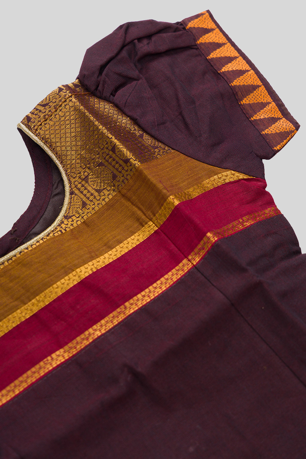 Close up sleeve details of Mehandi Green Readymade Cotton Pavadai Set with Zari Butta on the body and Zari And Thread Border