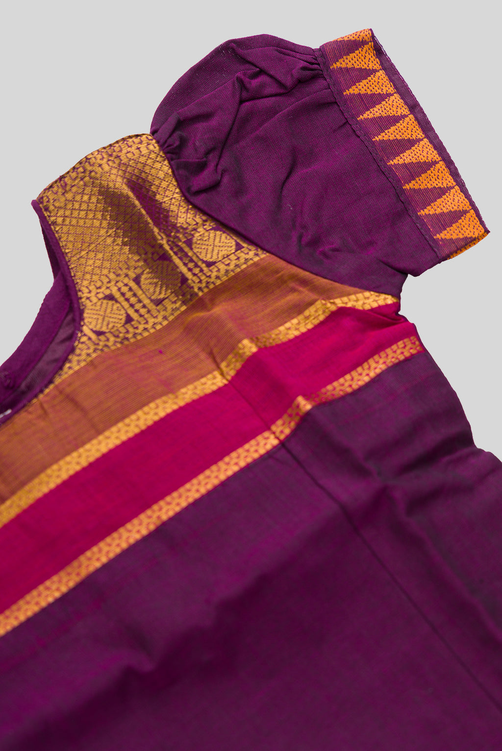 Close up sleeve details of Mehandi Green Readymade Cotton Pavadai Set with Zari Butta on the body and Zari And Thread Border