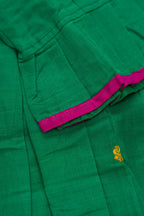 Detailed shot of Mehandi Green Readymade Cotton Pavadai Set with Zari Butta on the body and Thread Border