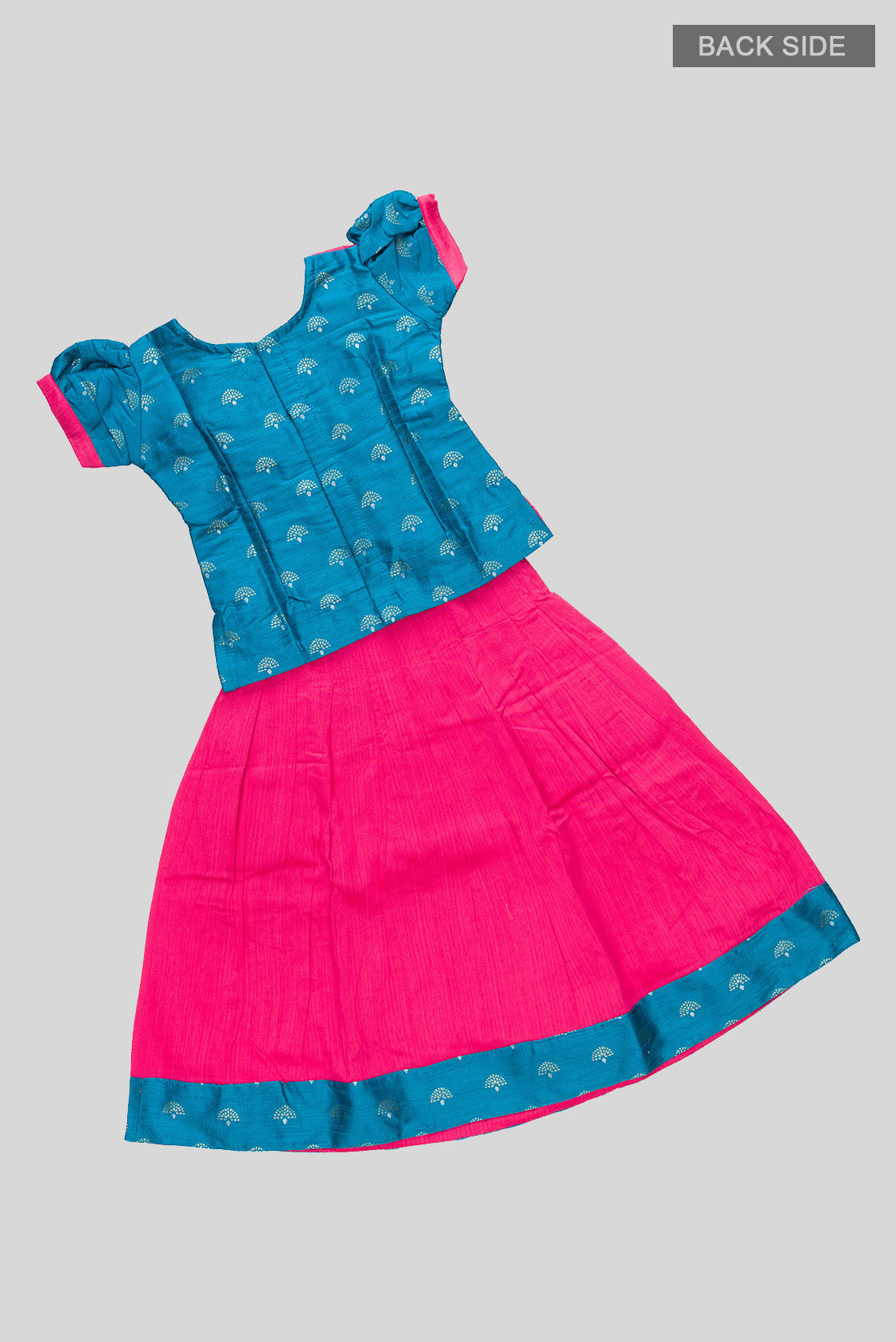 Flat lay back image of Pink Readymade Cotton Pavadai Set with Zari Butta on the body and Fancy Border
