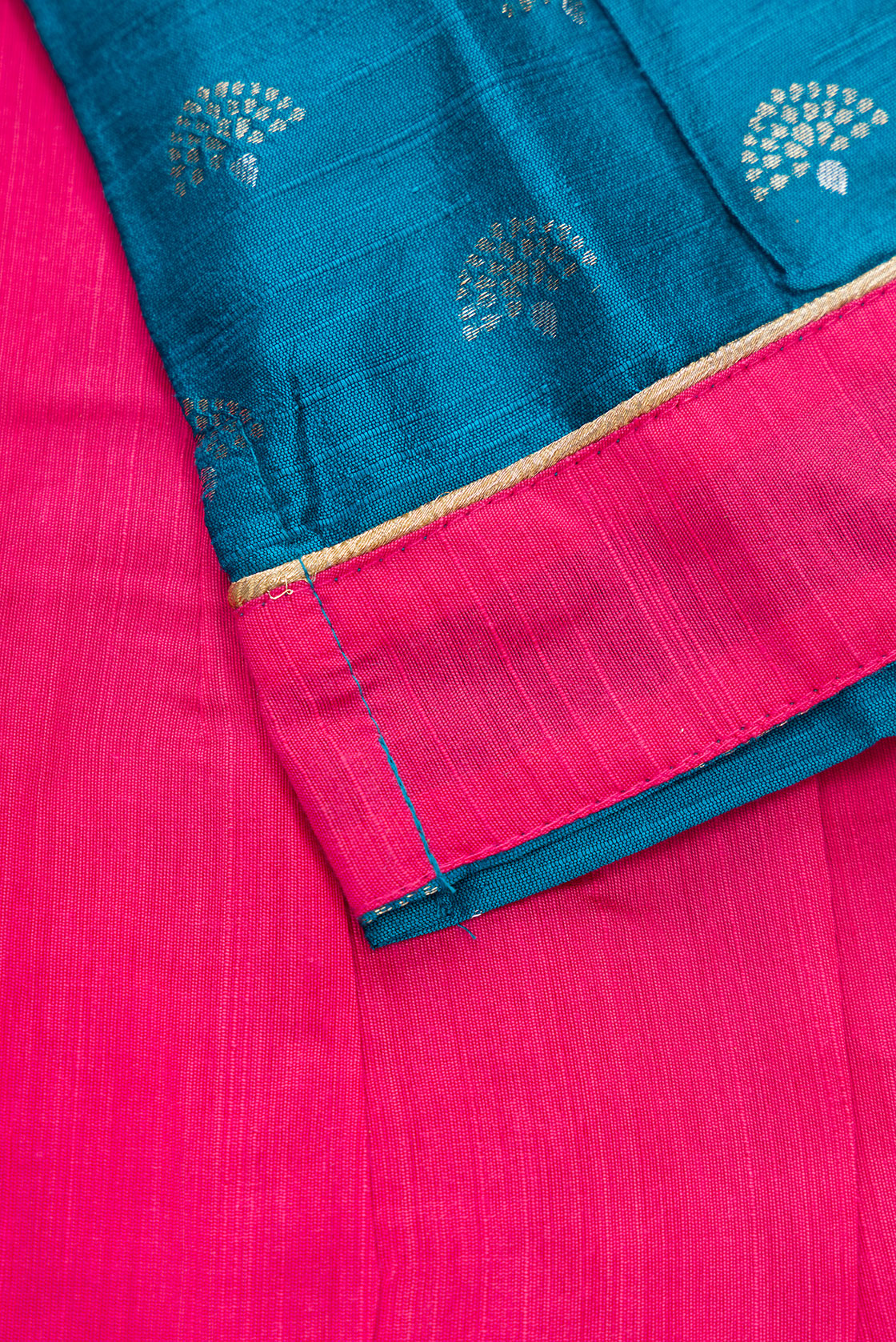 Detailed shot of Pink Readymade Cotton Pavadai Set with Zari Butta on the body and Fancy Border