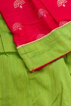 Detailed shot of Parrot Green Readymade Cotton Pavadai Set with Zari Butta on the body and Fancy Border