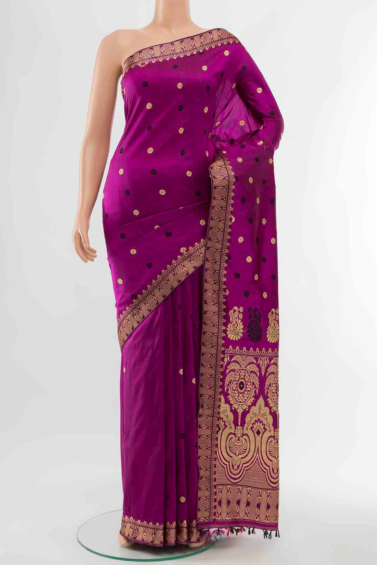 Magenta Assam Silk Saree with Zari Butta on the body and Silk Border displayed on a mannequin