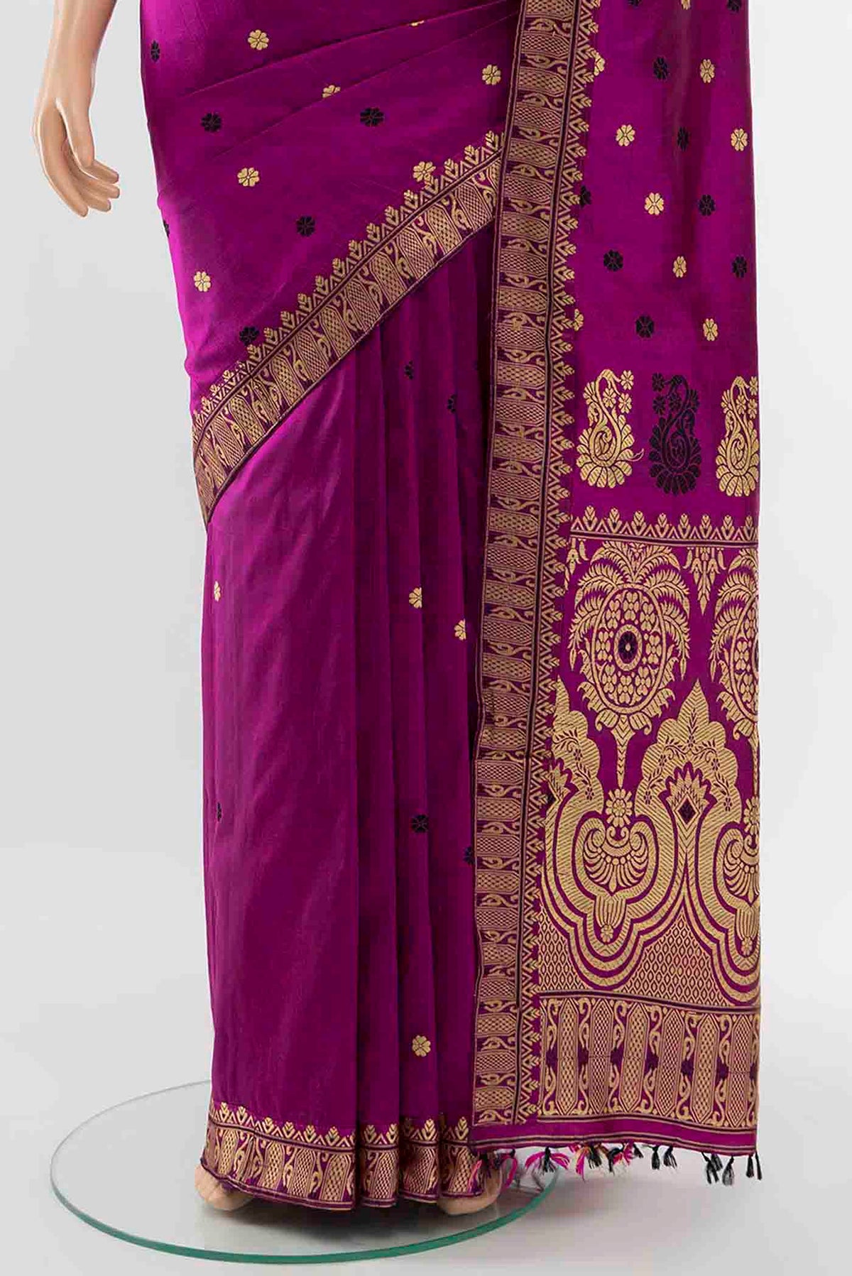Pleats and pallu of Magenta Assam Silk Saree with Zari Butta on the body and Silk Border
