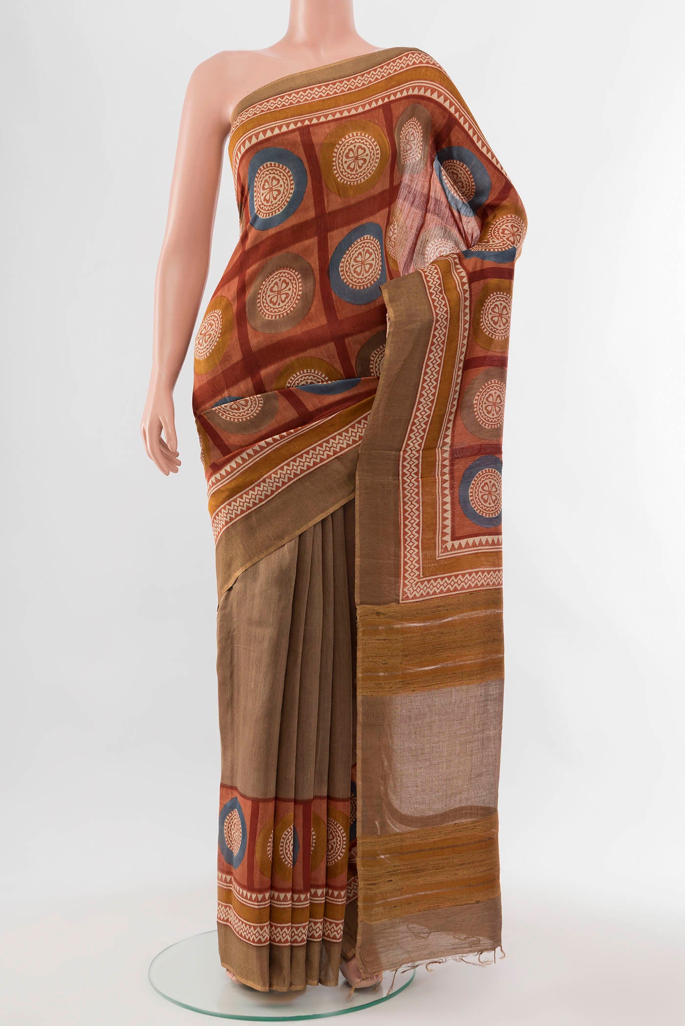 Beige Tussar Silk Saree with Floral Print on the body and Silk Border displayed on a mannequin
