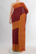 Pure Silk Maroon Soft Saree with Zari Butta on the body and Fancy Border.  displayed on a mannequin