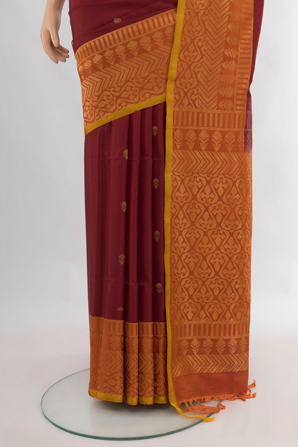 Pleats and pallu of Pure Silk Maroon Soft Saree with Zari Butta on the body and Fancy Border. 