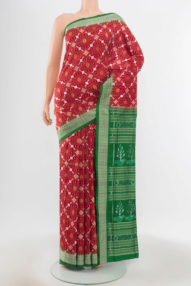 Multi Color Orissa Silk Saree with Ikat Print on the body and Silk Border.  displayed on a mannequin