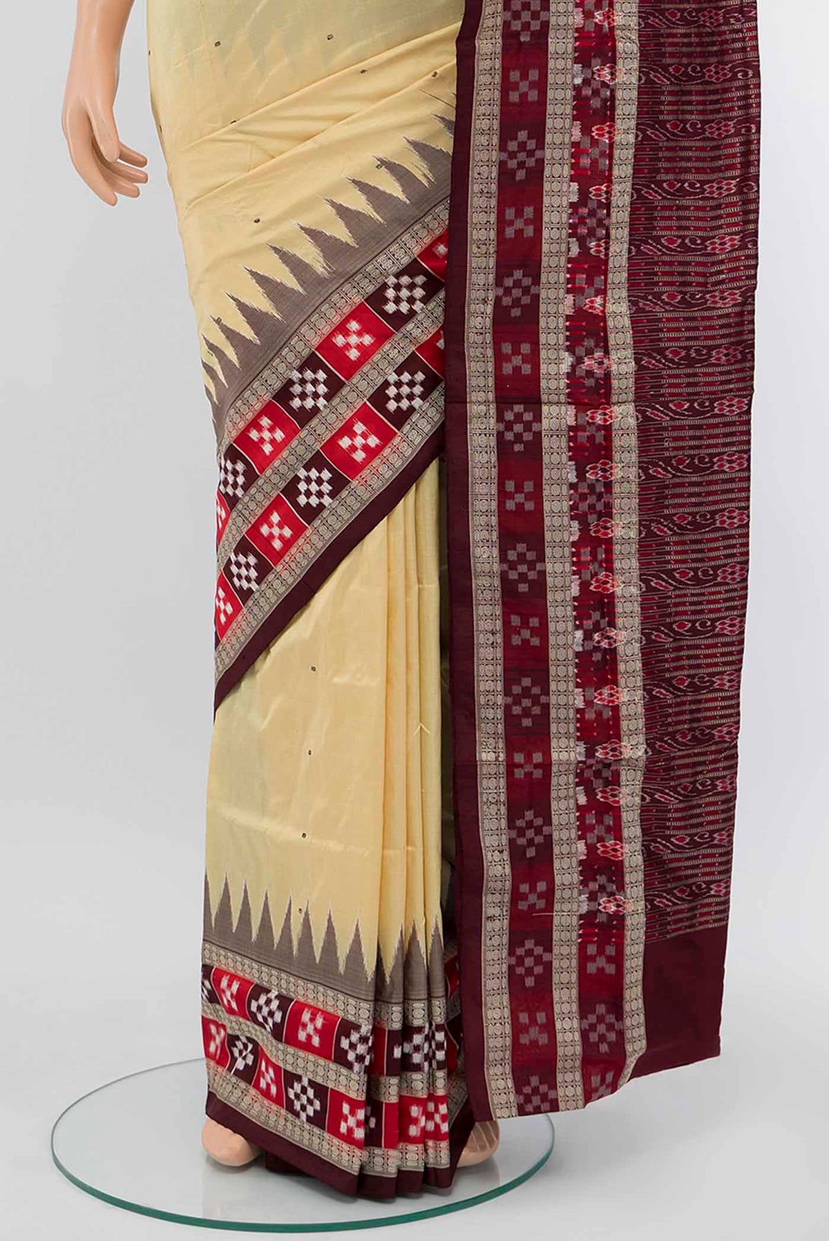 Pleats and pallu of Cream Assam Silk Saree with Jacquard With Thread Butta on the body and Silk Border