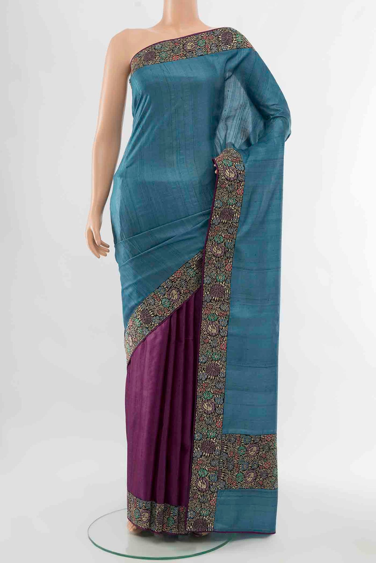 Blue Tussar Silk Saree with Thread Butta on the body and Thread Border displayed on a mannequin