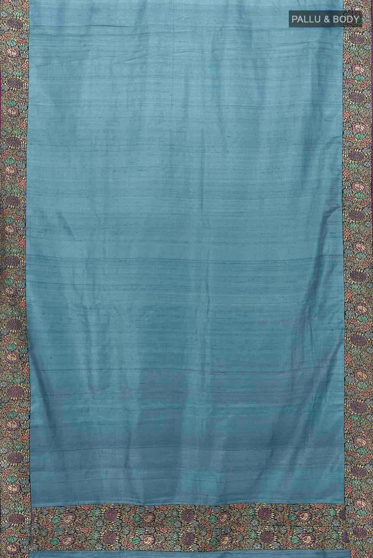 Flat view of Blue Tussar Silk Saree with Thread Butta on the body and Thread Border