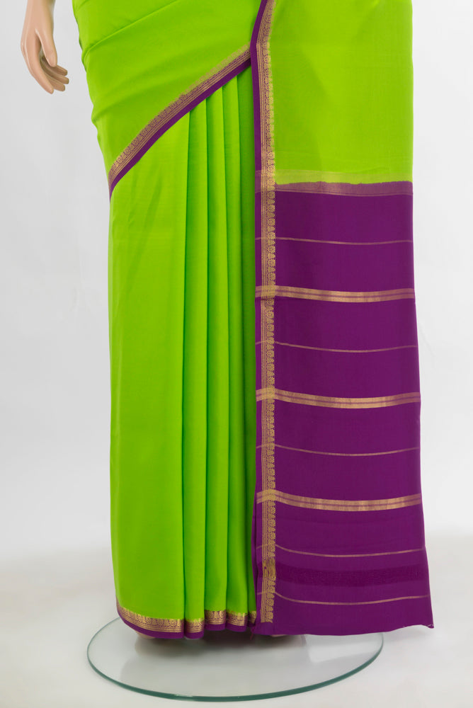 Pleats and pallu of Parrot Green Mysore Crepe Saree with Plain Body and Silk Border. 