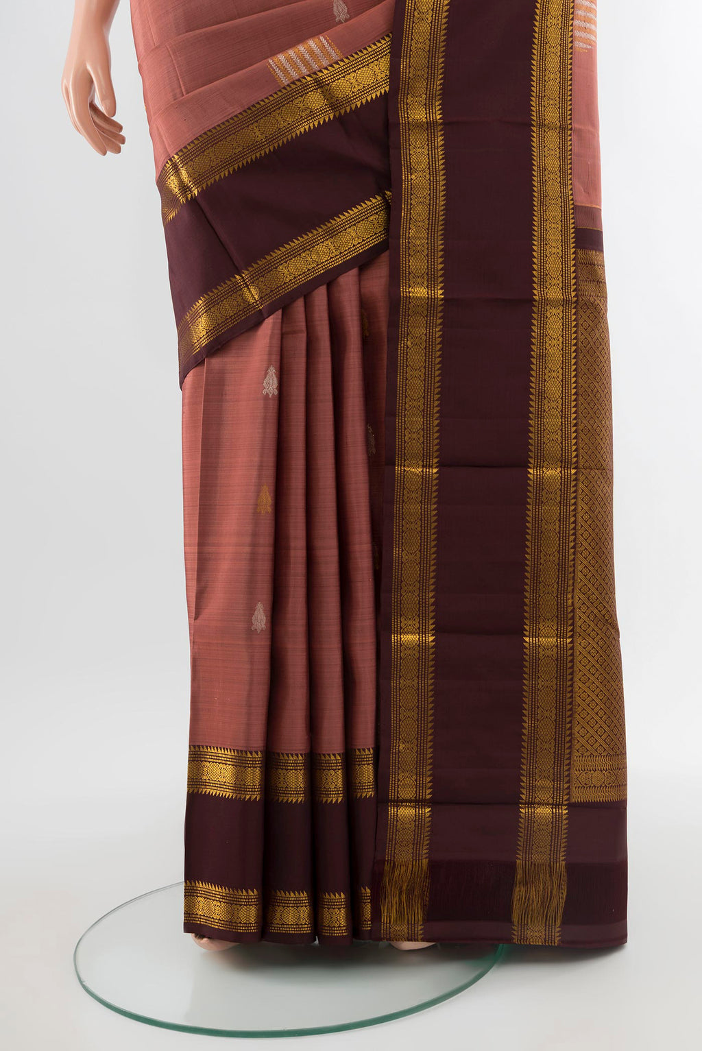 Pleats and pallu of Pure Silk Pure Zari Bronze Kanjivaram Saree with Zari Butta on the body and Silk Border. 