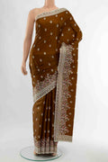 Bronze Art Silk Saree with Embroidery on the body and Fancy Border displayed on a mannequin