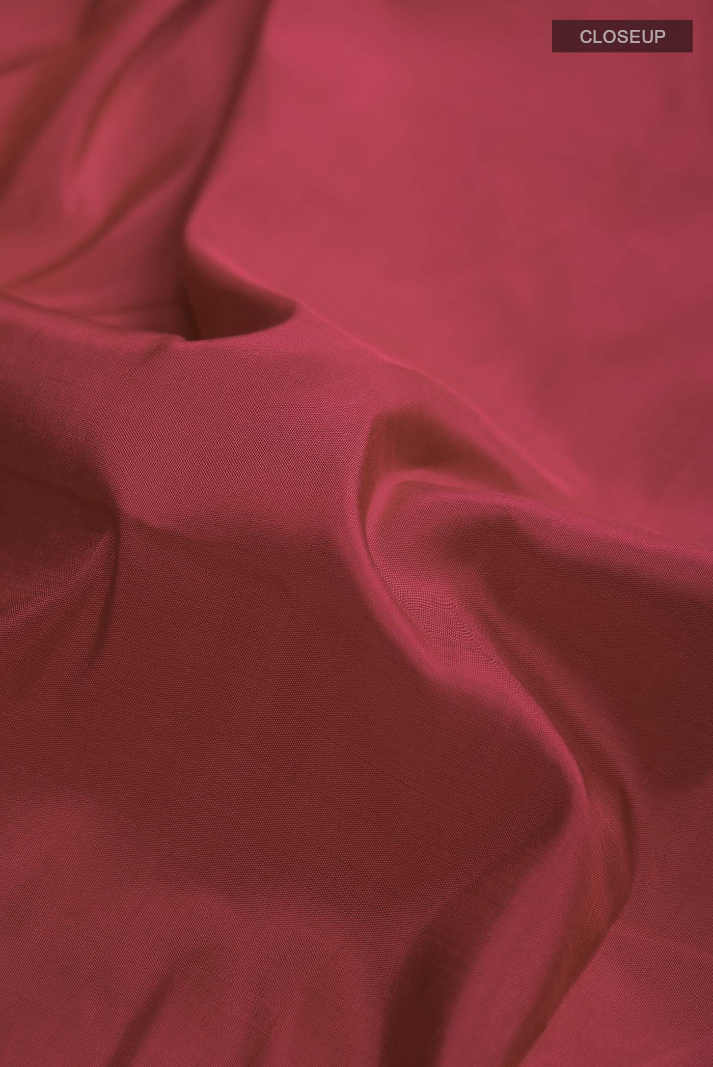 Close up of Pure Silk Pure Zari Maroon Kanchipuram Nine Yards Saree with Plain Body and Ganga Jamuna Border displaying folds