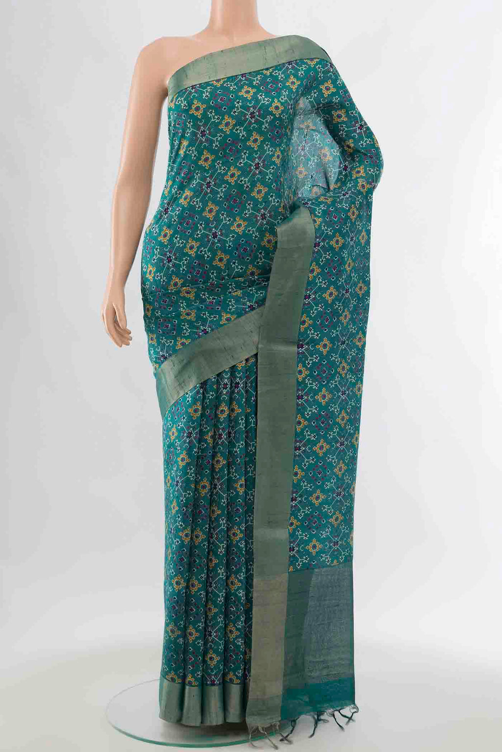 Blue Tussar Silk Saree with Ikat Print on the body and Zari Border displayed on a mannequin
